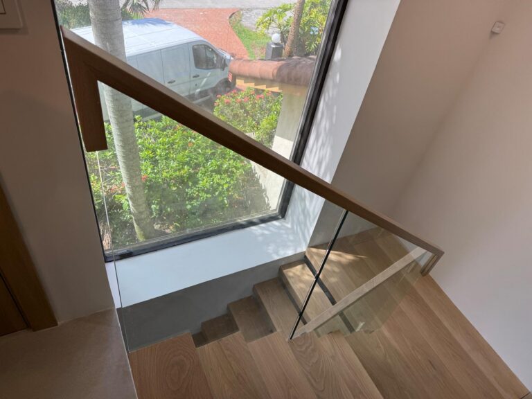 Glass railing with wood top cap